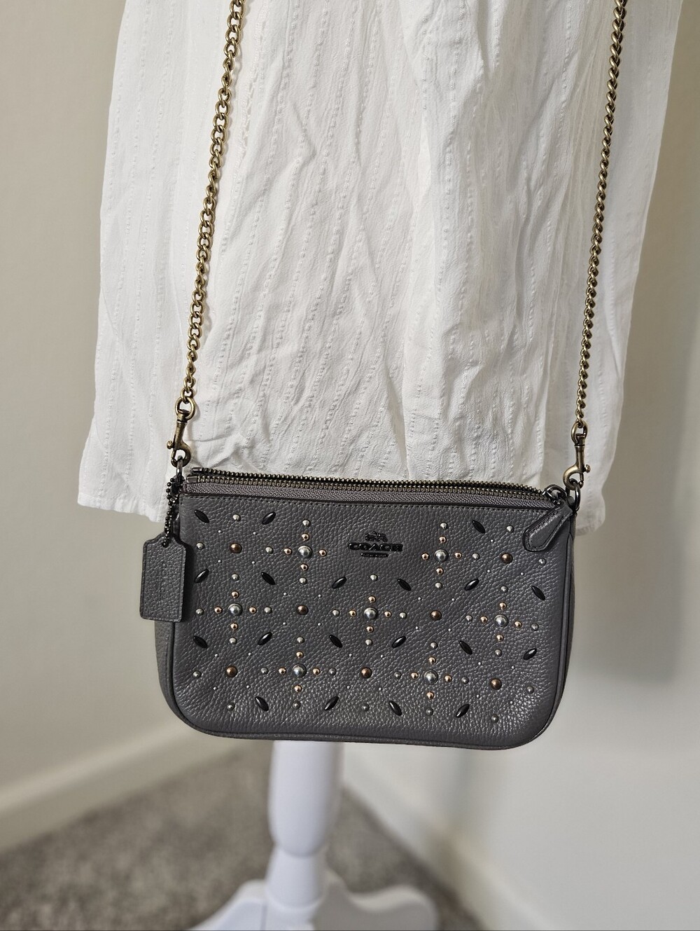 Coach Nolita Wristlet 22 featuring prairie rivets and studded detailing